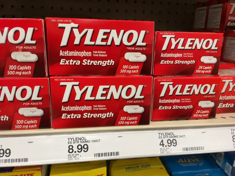 Boxes of Tylenol brand acetaminophen on a store shelf.